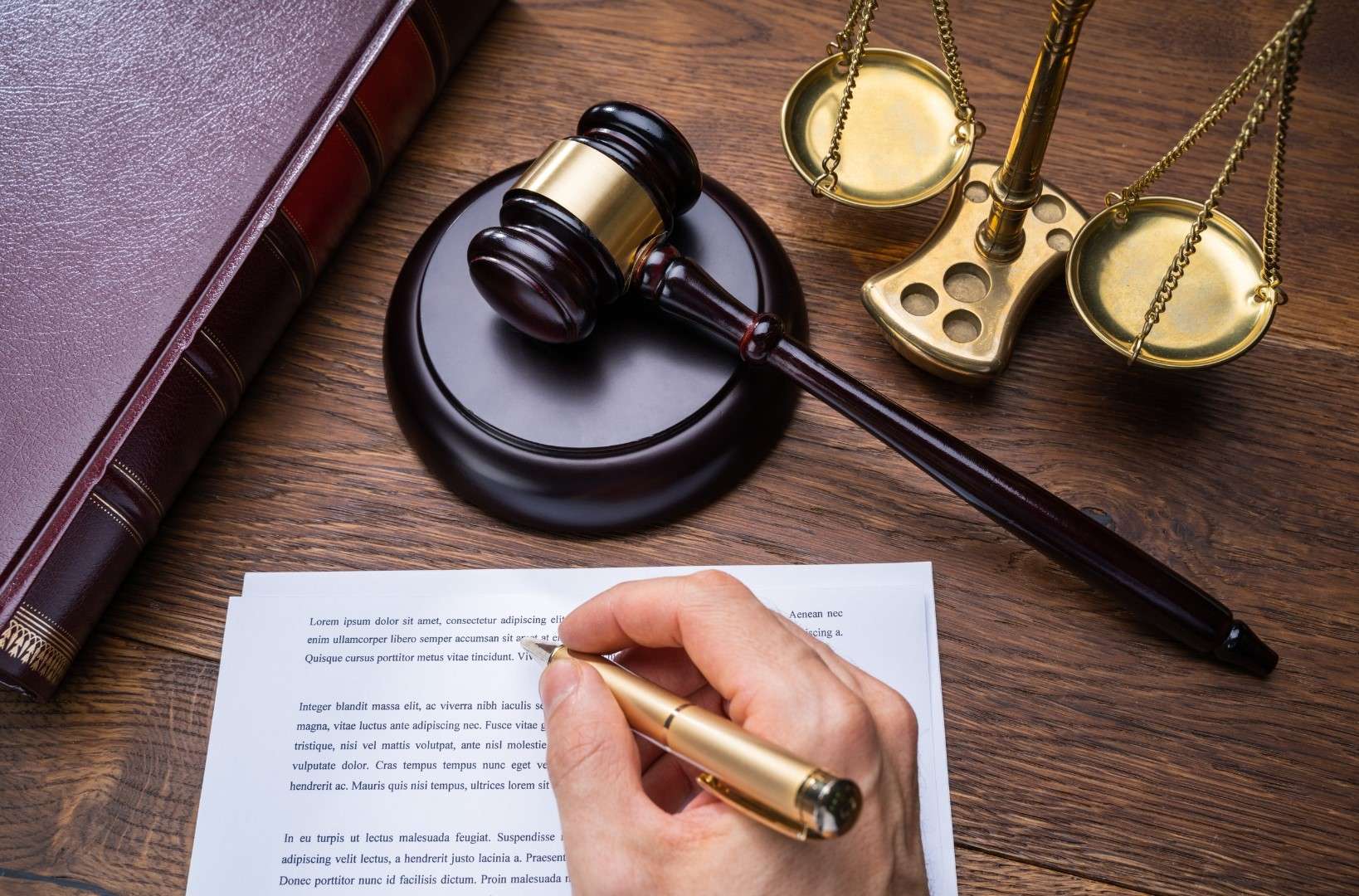 Attorney reviewing due diligence legal documents in Los Angeles during business acquisition.